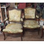 A PAIR OF LATE 19TH CENTURY CONTINENTAL WALNUT OPEN ARMCHAIRS In Aubusson tapestry upholstery.