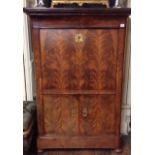 A 19TH CENTURY FRENCH FLAME MAHOGANY SECRÉTAIRE ABATTANT  The fall front enclosing a fitted