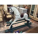 HADDON ROCKERS, A DAPPLE GREY ROCKING HORSE With a real hair mane and leather talk, on a painted