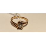 AN 18CT GOLD AND DIAMOND SOLITAIRE RING The brilliant cut diamond in a four claw setting, to a