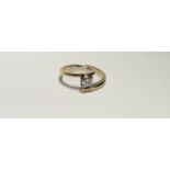 AN 18CT GOLD AND DIAMOND SOLITAIRE RING The Princess cut diamond collet set, to a half twist mount