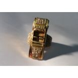 A GENTLEMEN'S HEAVY HALLMARKED 18CT GOLD AND DIAMOND RING In the form of a Rolls Royce sports car,