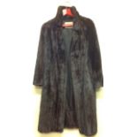 A VINTAGE DARK BROWN GLOSSY MINK LONG COAT By The National Fur Company Ltd, with snap lock and eye