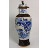 Late 19th Century Chinese Crackle Glazed Blue and White Lidded Vase. Overall height 13”.