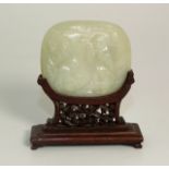 Carved Jade Robe Clasp Mounted on a Rosewood Stand. £80/120