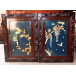 Pair of Oriental Lacquered Panels in Carved Wooden Frames with Raised Ivory and Bone Decoration,