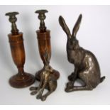Frith Resin Model of a Hare, other and Pair of Wooden Turned Candlesticks. £20/30