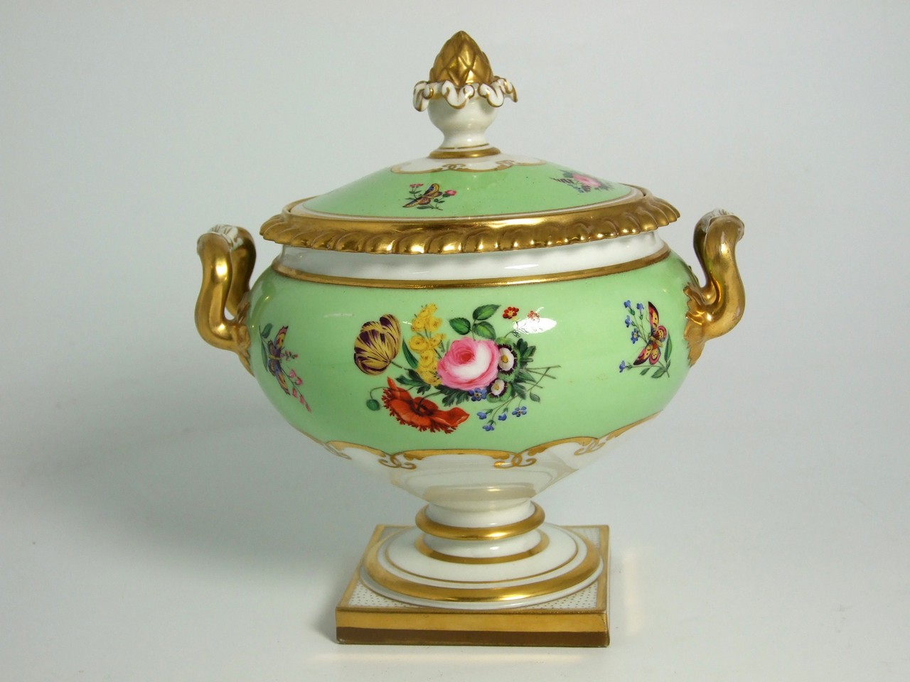 Continental Porcelain Sauce Tureen on Squared Base with Hand- painted Floral and Gilt Decoration. £