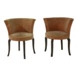 A pair of velvet upholstered cocktail chairs,  1940s, on shaped square ebonised supports (2)