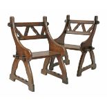 A pair of oak hall chairs, probably after a design by AWN Pugin, with chamfered and pegged