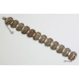 A Spanish silver and gold shell link bracelet, c.1950, with a series of clamshell shaped links, with