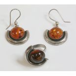 A Polish sterling silver and amber ring and earring suite, with a circular amber cabochon, rub set