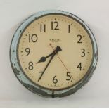 A large Magneta electric wall clock, grey finish with remnants of light blue paintwork, 54cm