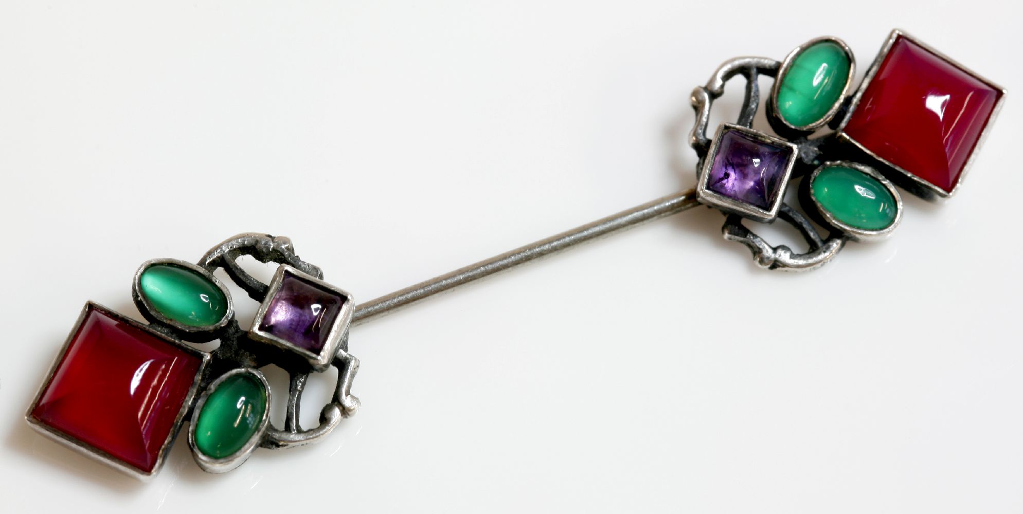 An Arts and Crafts silver amethyst and agate jabot, attributed to Sybil Dunlop.  A square cabochon