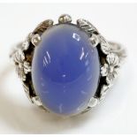 An Arts and Crafts silver single stone chalcedony ring, attributed to Bernard Instone, an oval