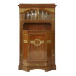 A Secessionist mahogany wall cabinet,  the moulded cornice over an arched and glazed cupboard,