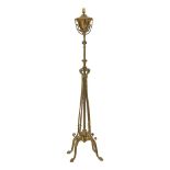 A Victorian brass telescopic standard lamp, with leaf applied cage on scrolled supports, converted