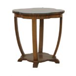 An Art Deco walnut occasional table, the shaped circular top raised on shaped struts, conforming