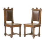 A pair of oak side chairs, in the style of AWN Pugin, with upholstered back and solid seats (2)