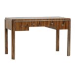 An Art Deco walnut desk,  with three frieze drawers, with applied metal strips with ring handles,