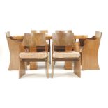 An Art Deco walnut set of six chairs, with veneered backs, solid sides and original cushions, and