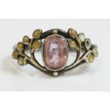 An Arts and Crafts silver, gold, pink tourmaline and enamel ring attributed to Jessie M King,  an