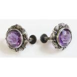 A pair of silver Arts and Crafts amethyst earrings, attributed to Bernard Instone, a circular