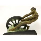 An Art Deco bronzed spelter figure,  by A Margelin, depicting a muscular man pulling a broken