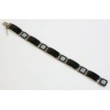 A Norwegian black enamel plaque bracelet, by Aksel Holmsen, with a series of curved rectangular