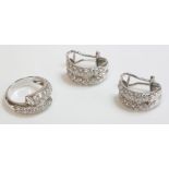 A white gold paste set crossover ring, and a pair of earrings marked 750 (3)