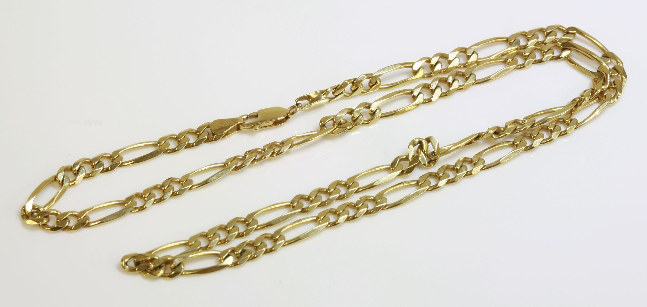 A 9ct gold figaro chain