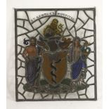 A stained and lead glass panel, depicting figures either side of a coat of arms for St George's