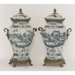 A pair of Chinese style vases and covers, with cast metal mounts, 45cm (2)