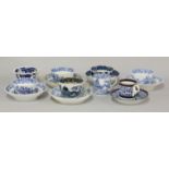 A large quantity of late 18th/early 19th century English blue and white mixed cups and saucers,