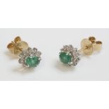 A pair of emerald and diamond oval cluster earrings, marked 18K (2)