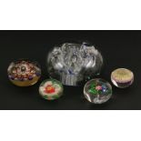 Five various glass paperweights, the largest 11cm diameter, including one millefiore and one