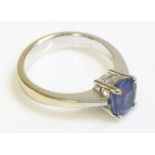 A white gold single stone sapphire ring, marked 750
