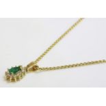 A pear shaped emerald and diamond gold cluster pendant, marked 18K, suspended on a palmier chain