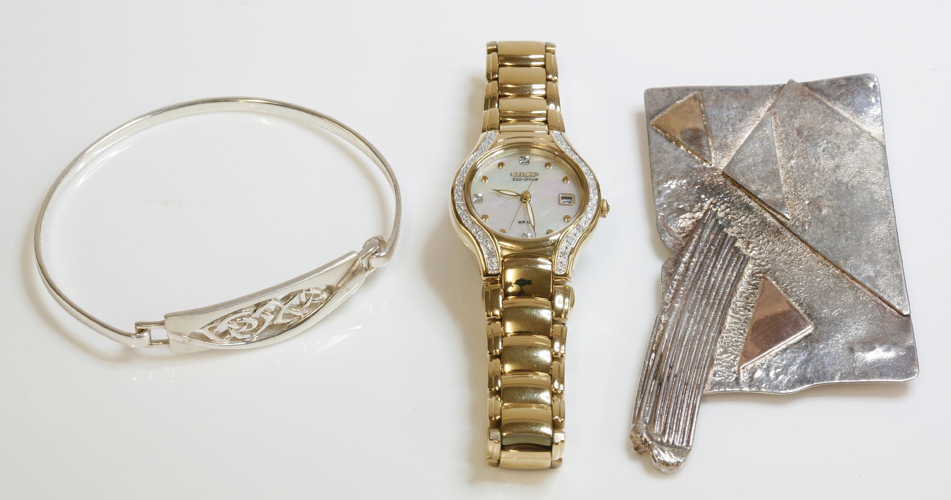 A ladies gold plated diamond set Citizen Eco Drive bracelet watch, with original box, guarantee,
