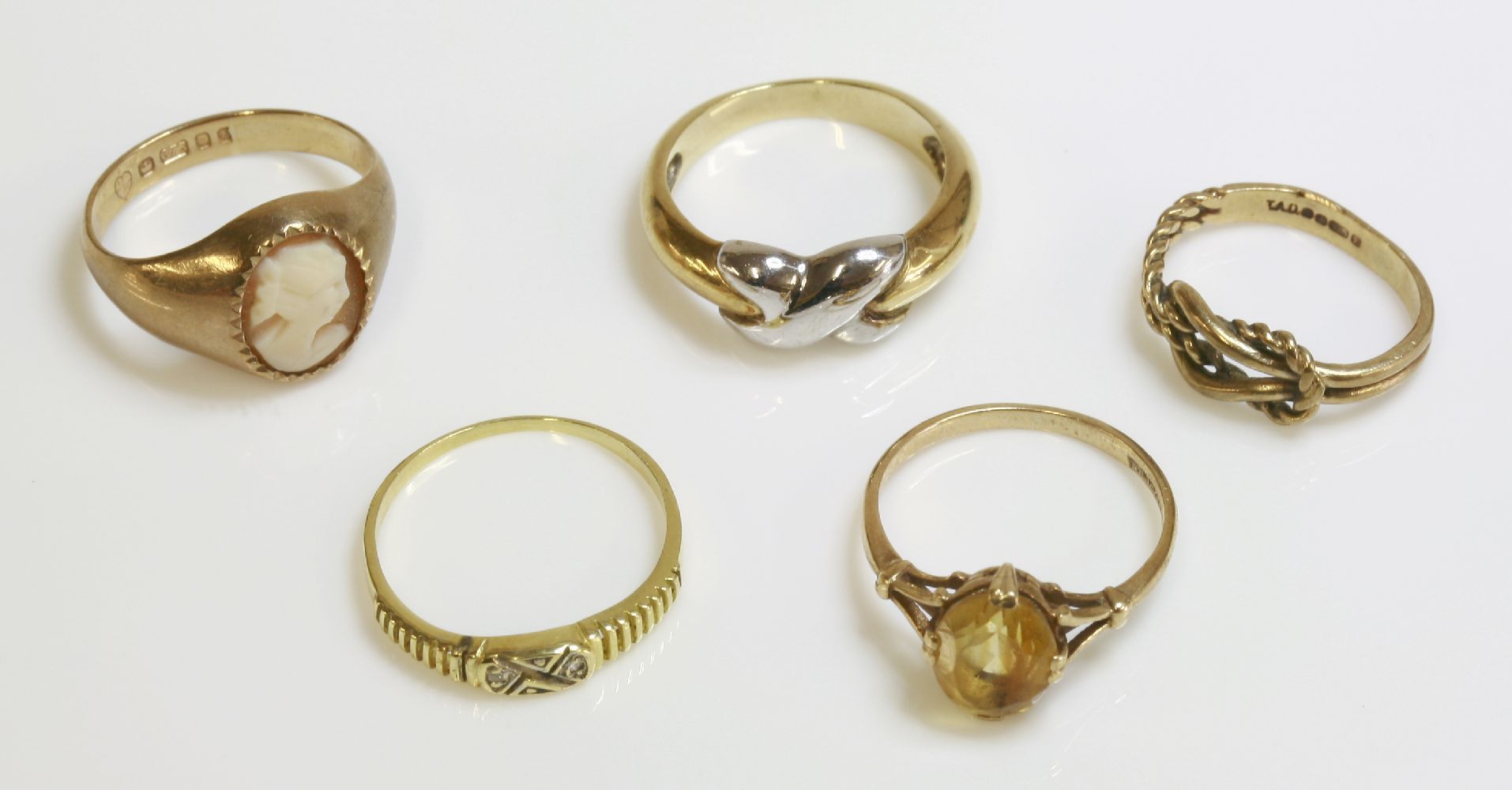 Four 9ct gold rings, and a gold diamond set ring (5)