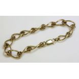 A 9ct gold open curb and twisted wire link bracelet