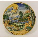 A maiolica Dish,possibly Faenza, late 16th century, painted in a typical palette with an