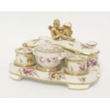 A Spode Inkstand,early 19th century, having three quill holders, a rectangular pen box, the lid with