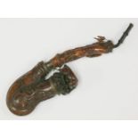 An unusual walnut pipe,Swiss or Austrian, 19th century, well carved with a courting couple, stags,