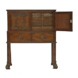 A mahogany collector's cabinet,in the Chippendale style, the two doors with carved detail
