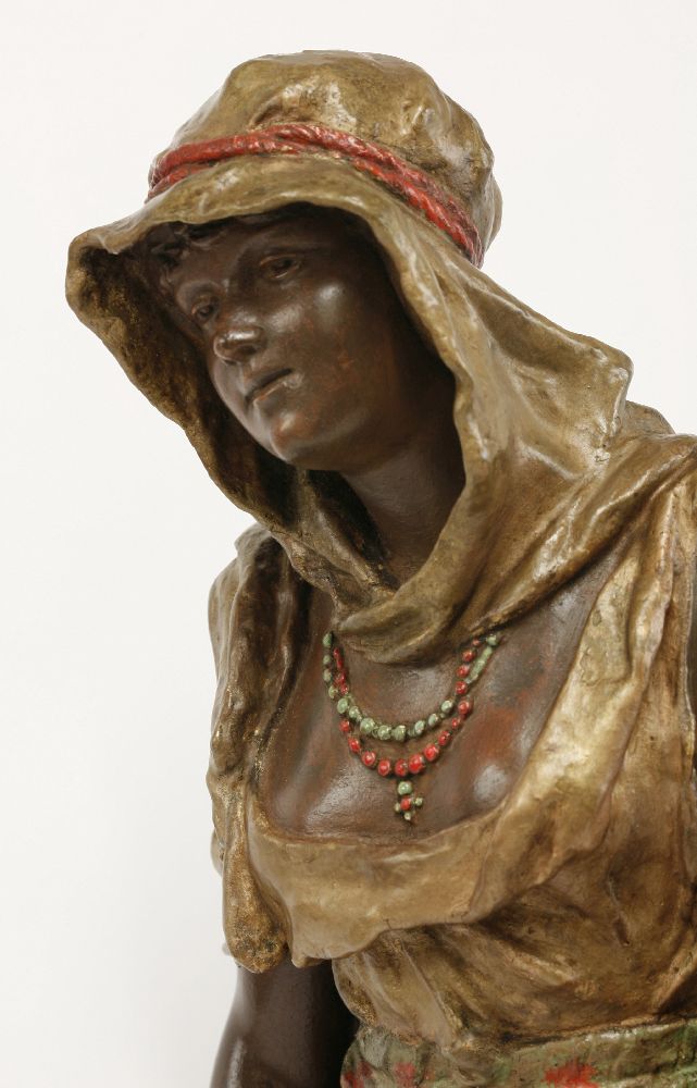 A spelter figure of an Arab girl,standing beside a brazier holding a lute and a dish, signed 'L - Image 3 of 5