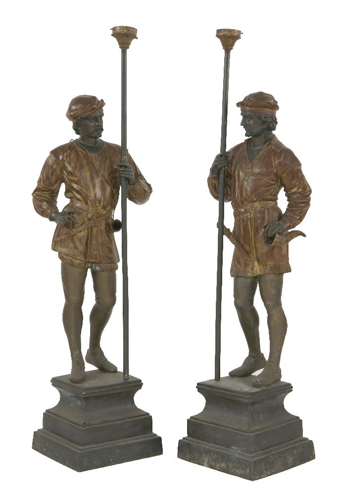 A pair of cast figures,after originals by A Guillot, each dressed in medieval clothes holding