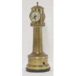 A Victorian brass lighthouse clock,the revolving top with clock, barometer and two thermometers on a