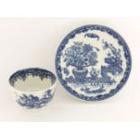 A Worcester blue and white Tea Bowl and Saucer,c.1780, printed in 'The Bat' pattern, disguised