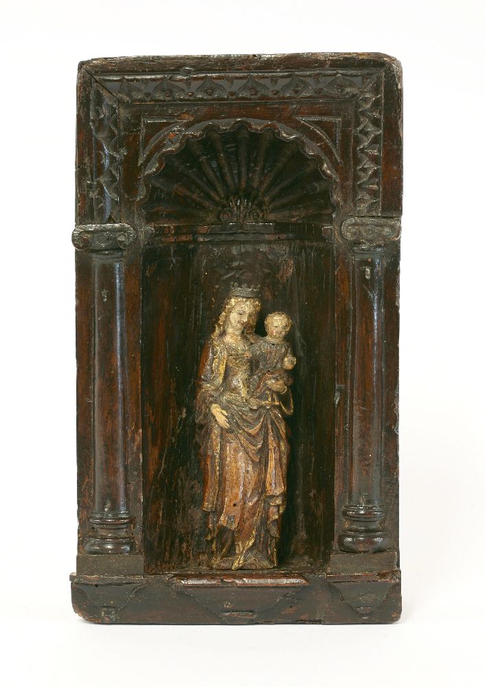 A German carved limewood figure of the Virgin and Child,16th century, the Virgin wearing an